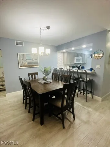 a view of a dining room with furniture