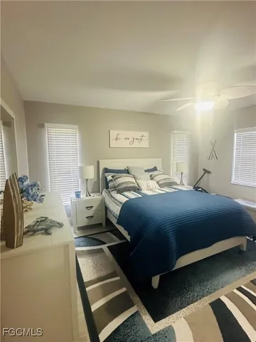 a bedroom with a bed and a couch