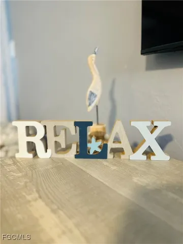 a view of swimming pool with garden and palm tree