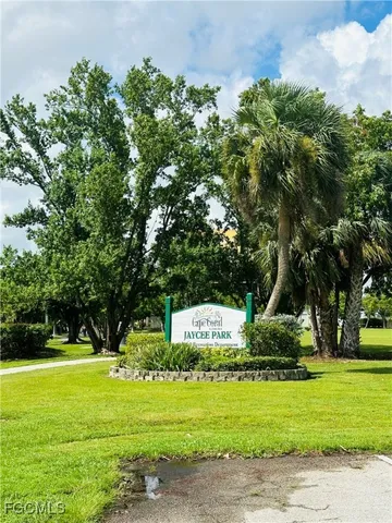a view of a yard with swimming pool and sitting area