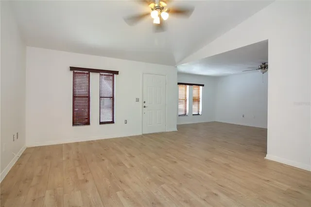 a view of an empty room with a window