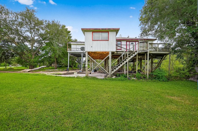 523-525 Shady Oaks Harbor Road Alvin, TX 77511 - Photo 2 of 23 a view of a house with a backyard