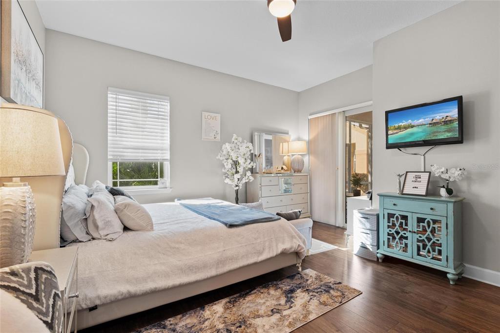 1444 Ridge Terrace Tarpon Springs, FL 34689 - Photo 21 of 30 a bedroom with a bed and a flat screen tv