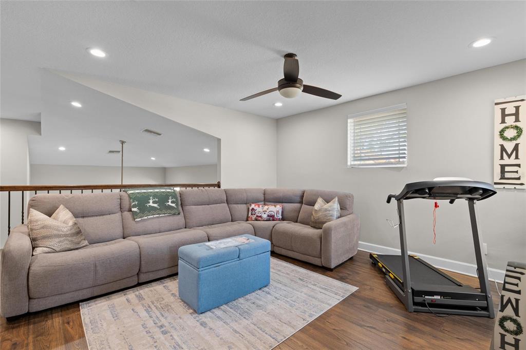 1444 Ridge Terrace Tarpon Springs, FL 34689 - Photo 22 of 30 a living room with furniture and a ceiling fan