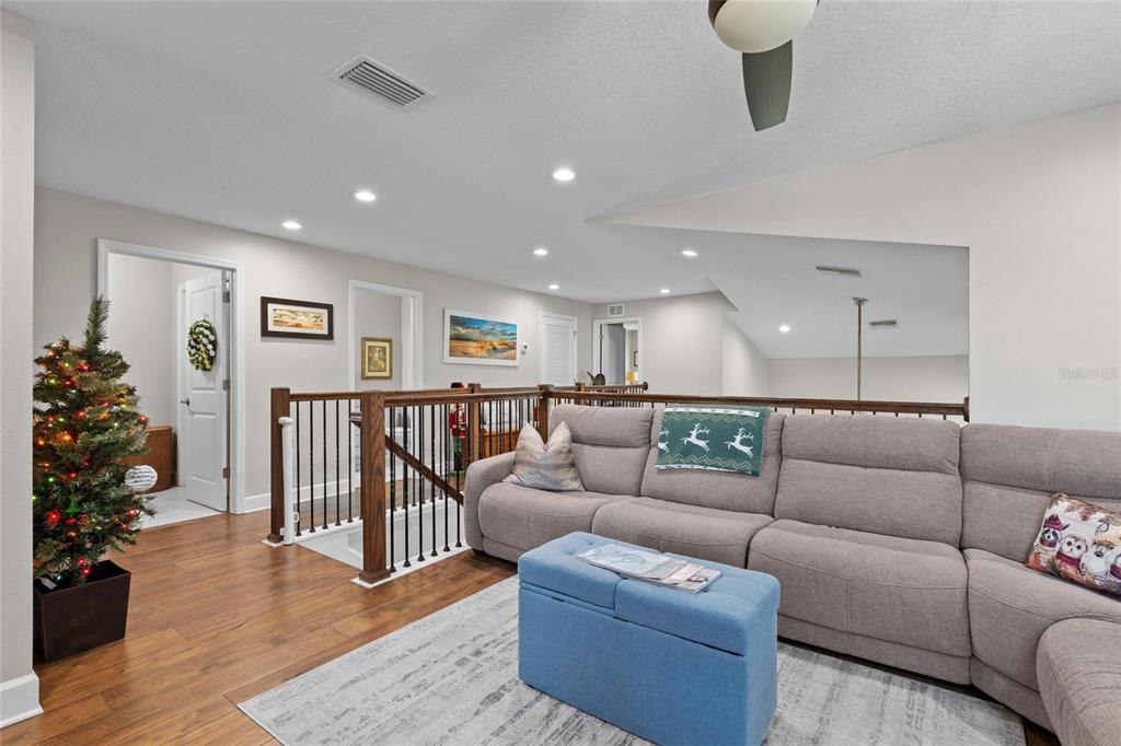 1444 Ridge Terrace Tarpon Springs, FL 34689 - Photo 23 of 30 a living room with furniture and wooden floor