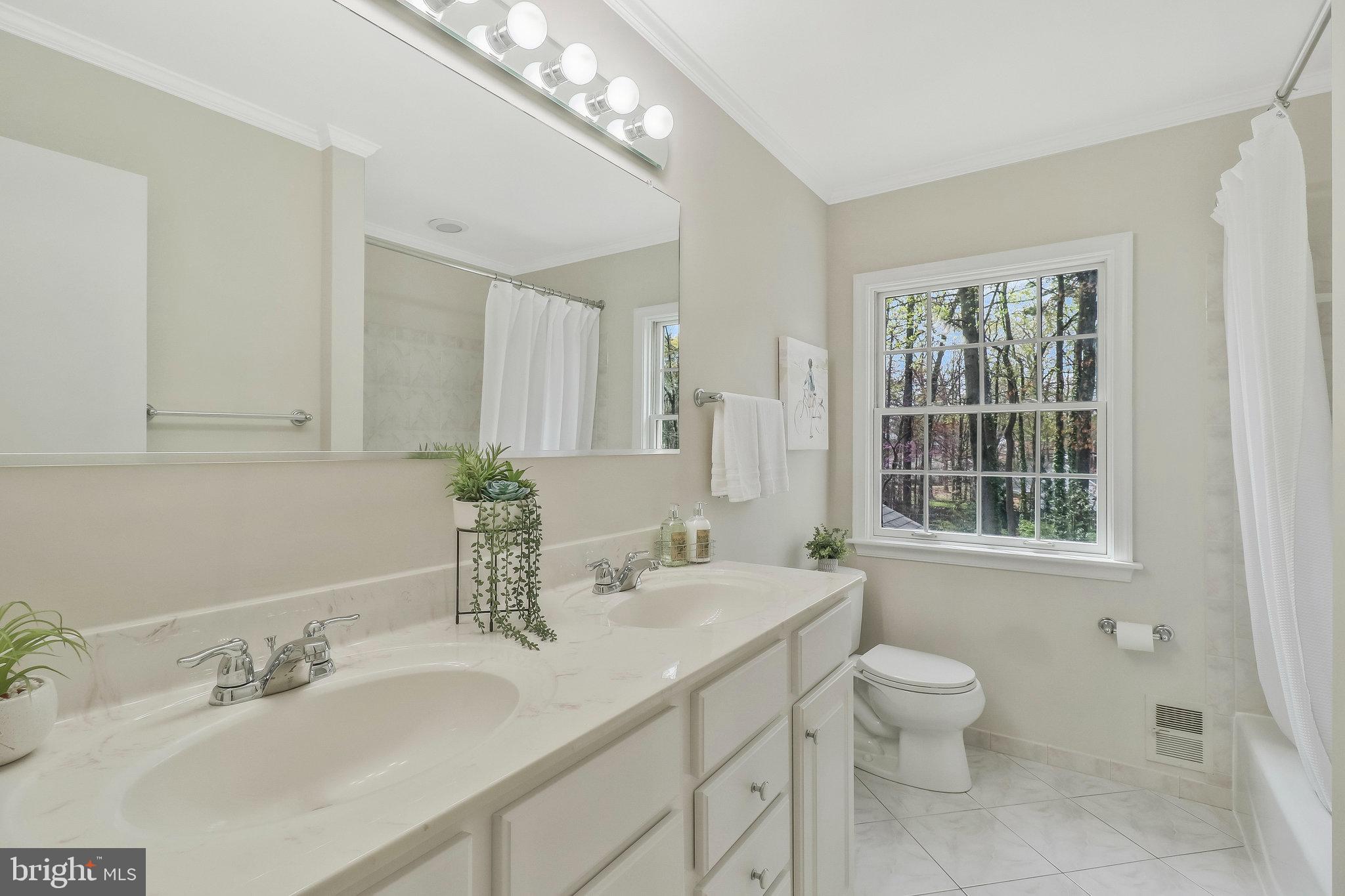 6132 Roxbury Avenue Springfield, VA 22152 - Photo 35 of 70 Roomy hall bathroom with double sink vanity.
