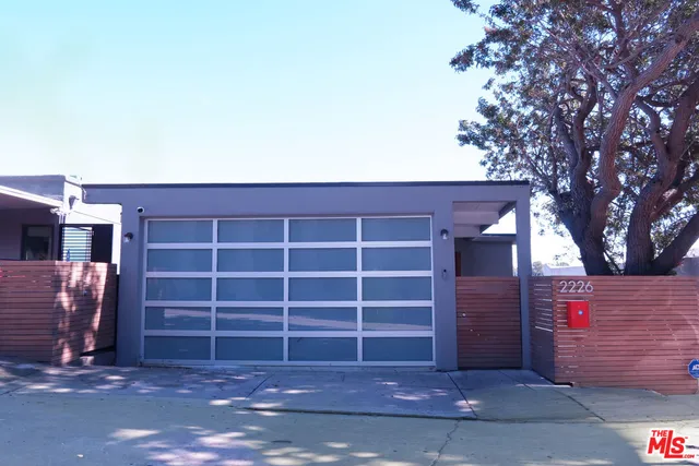 a view of an empty room with a tree
