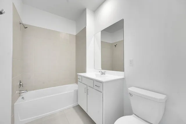 a bathroom with a toilet a sink and a bathtub