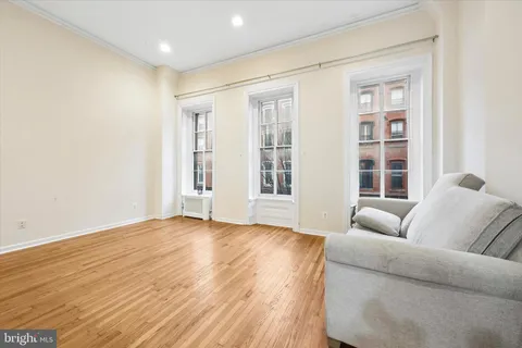 a living room with furniture and windows