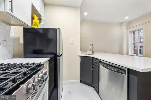 a kitchen with a stove and a microwave