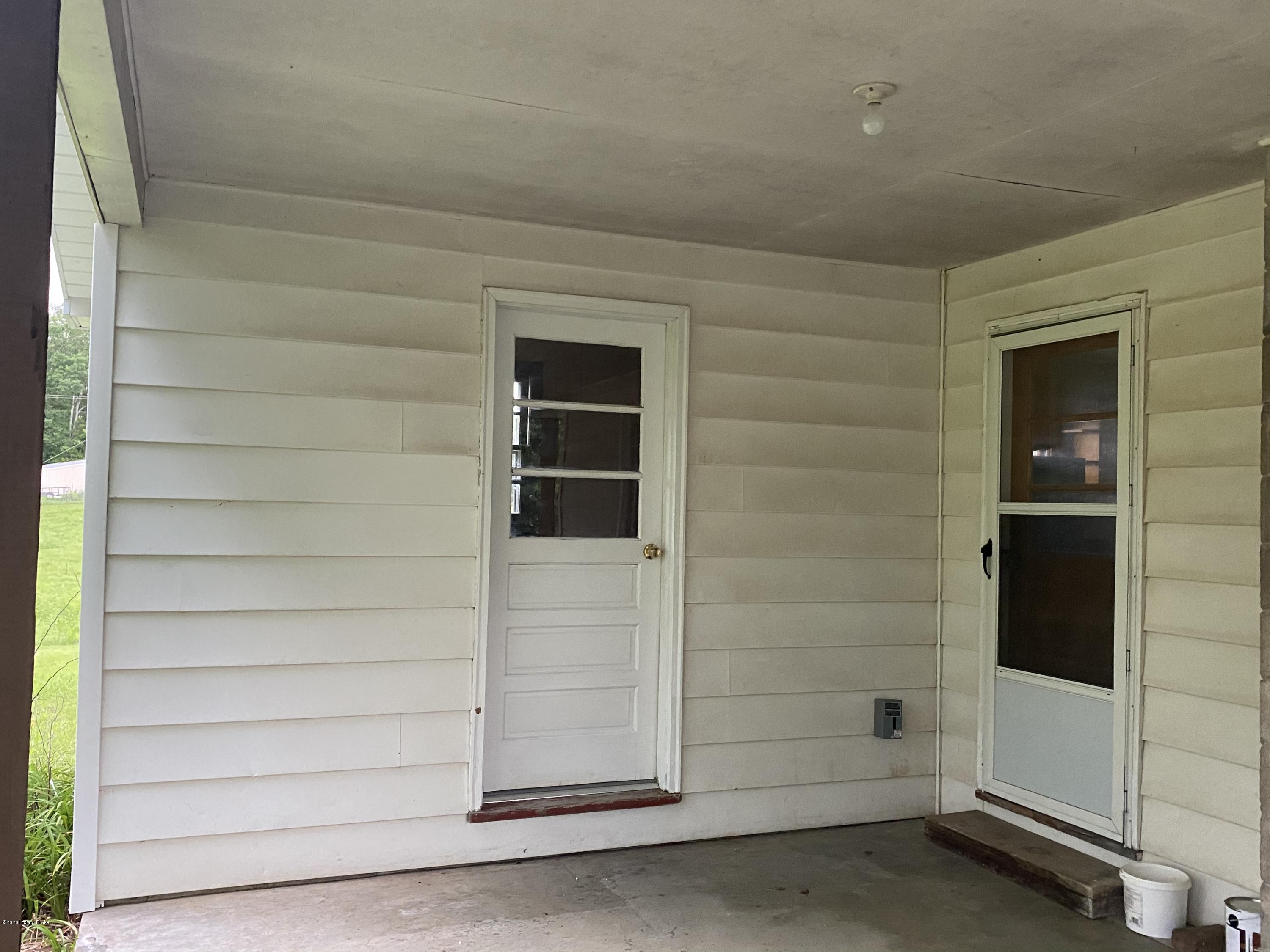 1249 Dickey Mill Road Mammoth Cave, KY 42259 - Photo 17 of 25 carport with laundry area and hot water heater