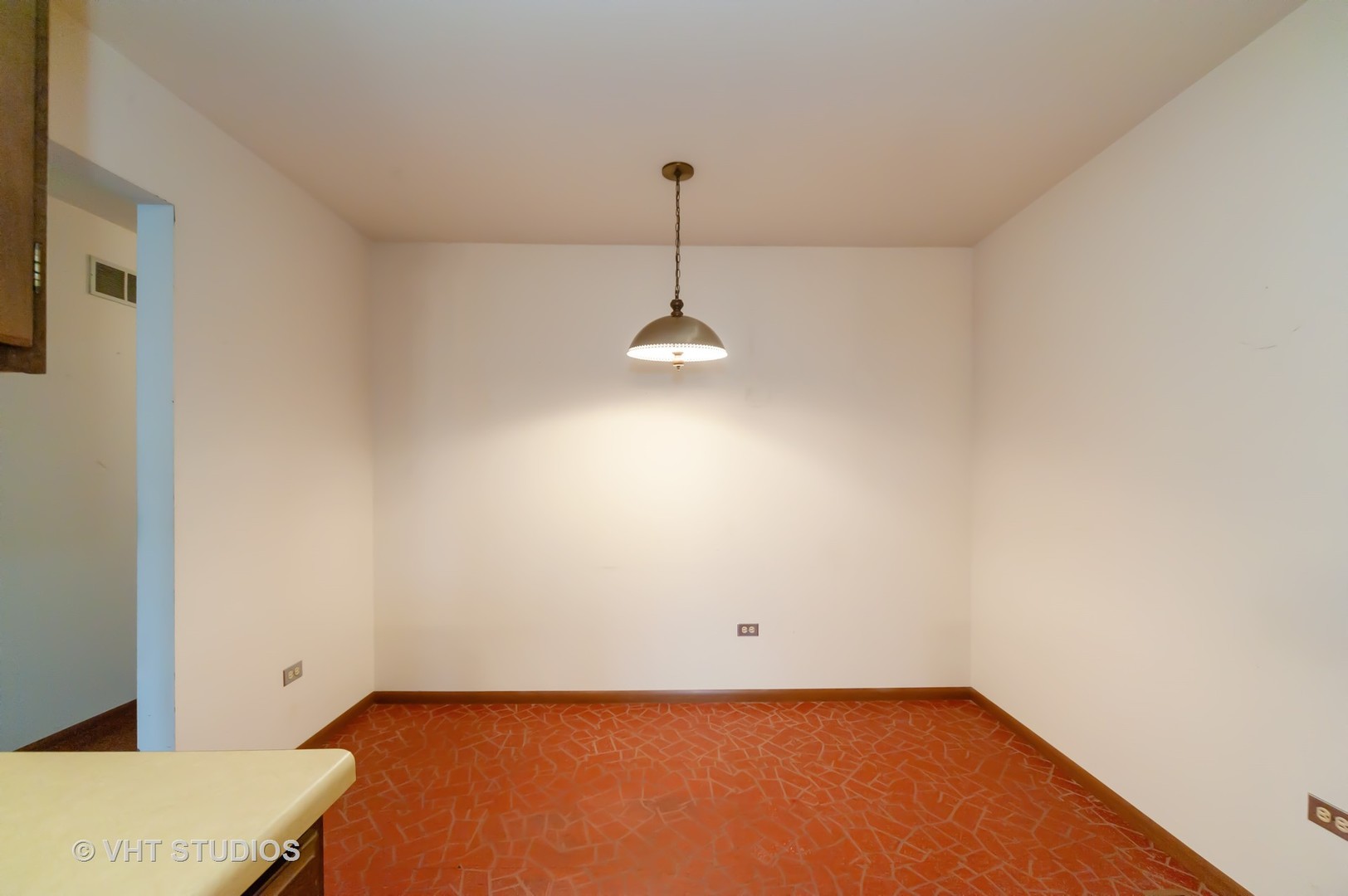 1485 Chippewa Trail Wheeling, IL 60090 - Photo 9 of 20 a view of a room with a ceiling fan and a wooden floor