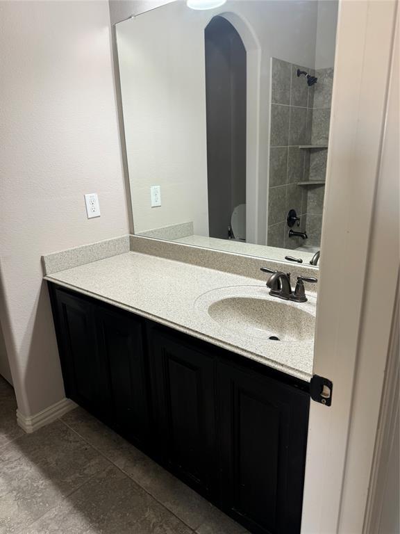 236 Archer Way Forney, TX 75126 - Photo 13 of 35 a bathroom with a sink vanity and a mirror