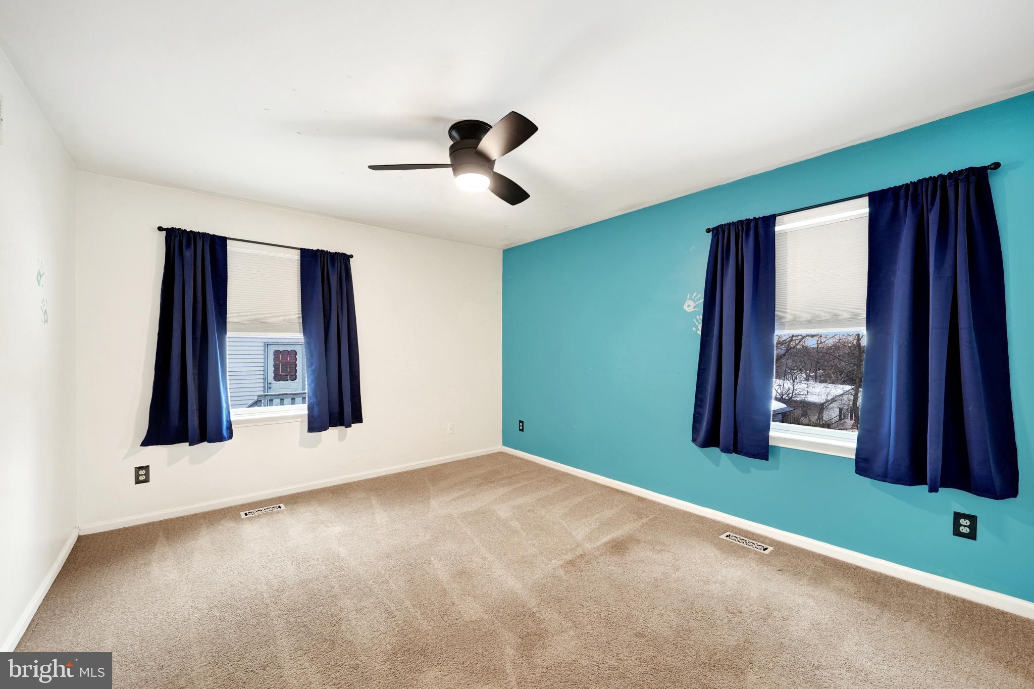 335 East Village Road Elkton, MD 21921 - Photo 26 of 29 a view of an empty room with a fireplace and a window