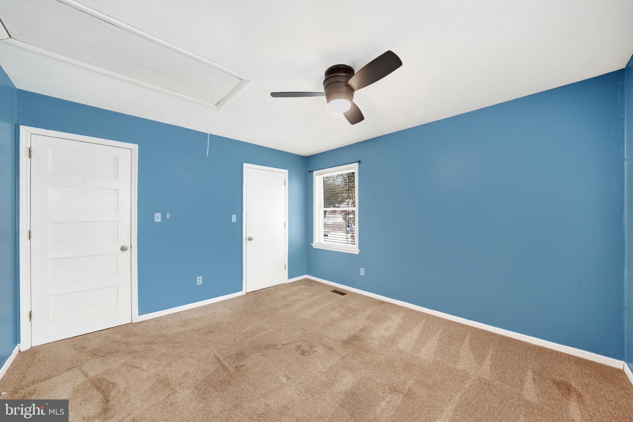 335 East Village Road Elkton, MD 21921 - Photo 5 of 29 a view of a big room with a ceiling fan and a window