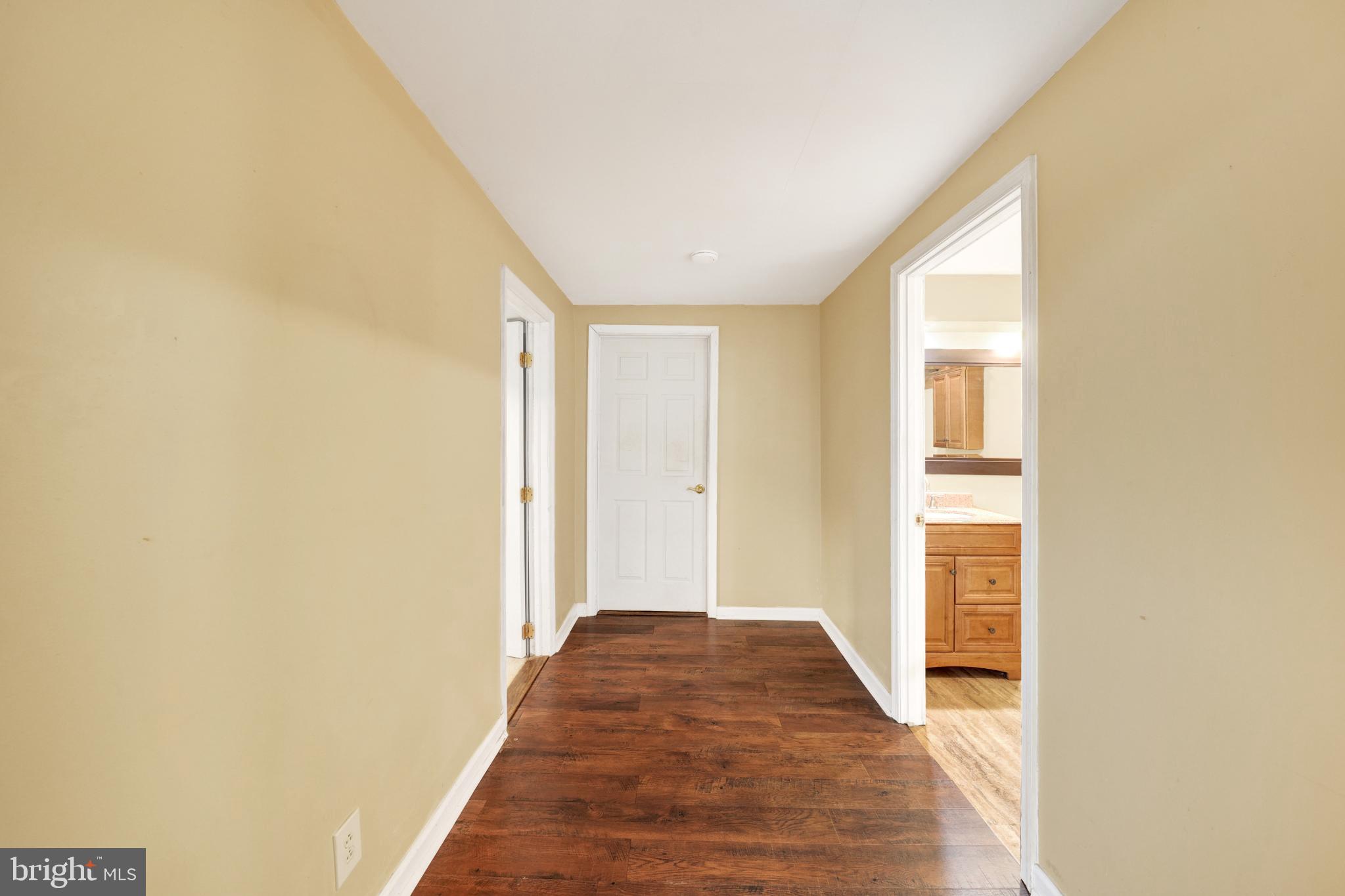 335 East Village Road Elkton, MD 21921 - Photo 10 of 29 a view of a hallway with wooden floor and a bathroom