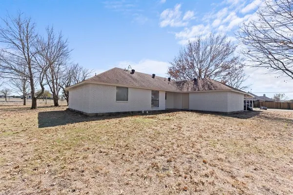 a house with trees in front of it