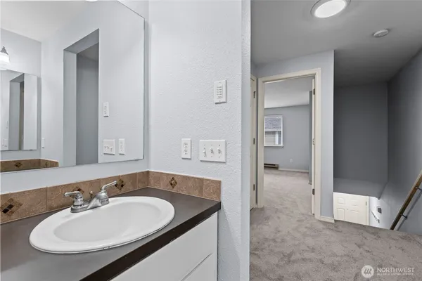 a bathroom with a sink and a mirror