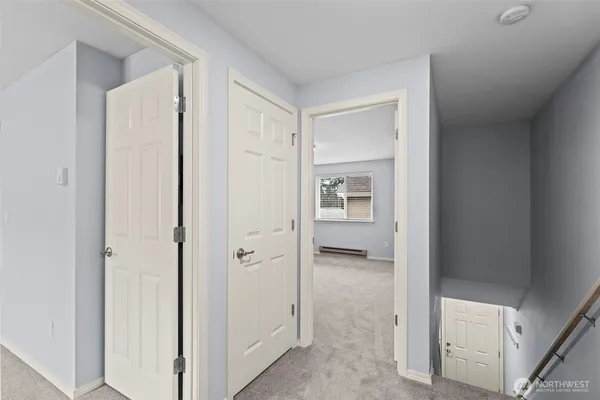 a view of a bathroom from a hallway