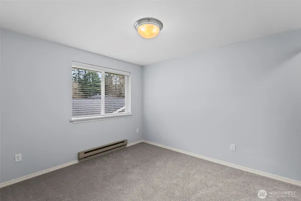 a view of an empty room and a window