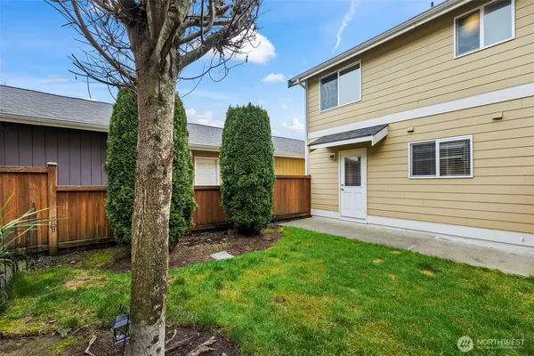 a view of a back yard of the house