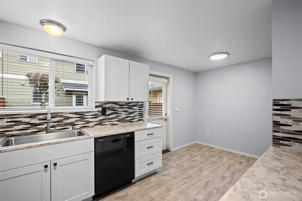 a kitchen with a stove and a sink