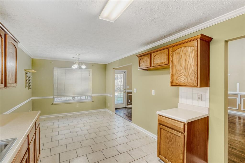 1298 Sierra Ridge Place Southeast Loganville, GA 30052 - Photo 13 of 29 a bathroom with a sink a mirror and a bathtub