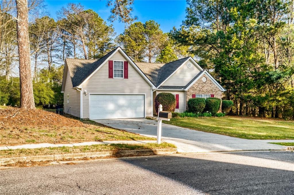 1298 Sierra Ridge Place Southeast Loganville, GA 30052 - Photo 2 of 29 a front view of house with yard and green space