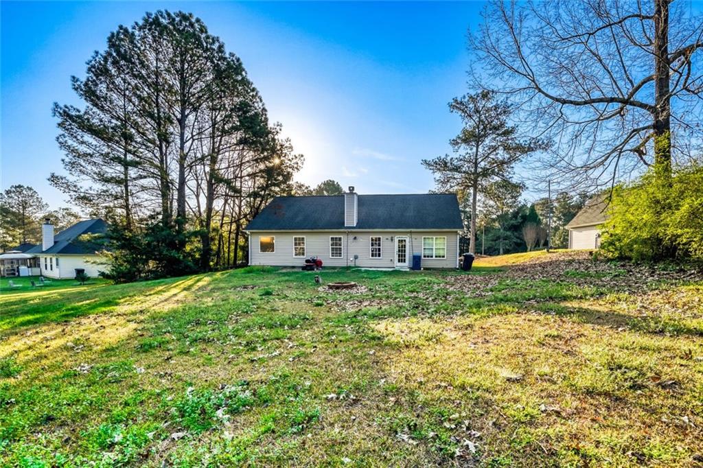 1298 Sierra Ridge Place Southeast Loganville, GA 30052 - Photo 26 of 29 a view of a house with yard and a tree