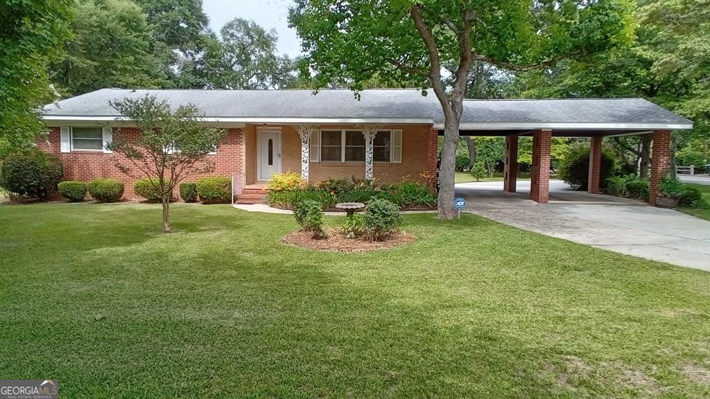 1301 Skyline Drive Dublin, GA 31021 - Photo 1 of 1 a front view of a house with a yard and porch