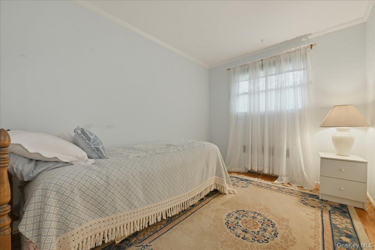 17 Avon Road Farmingdale, NY 11735 - Photo 20 of 46 a bedroom with a bed and a window
