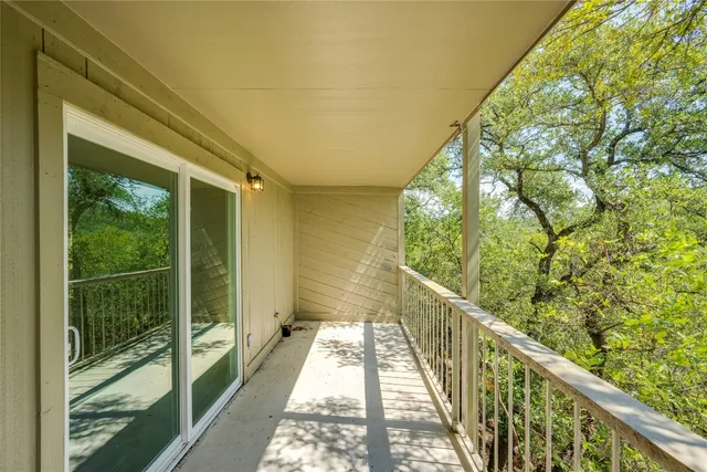 a view of balcony with wooden floor