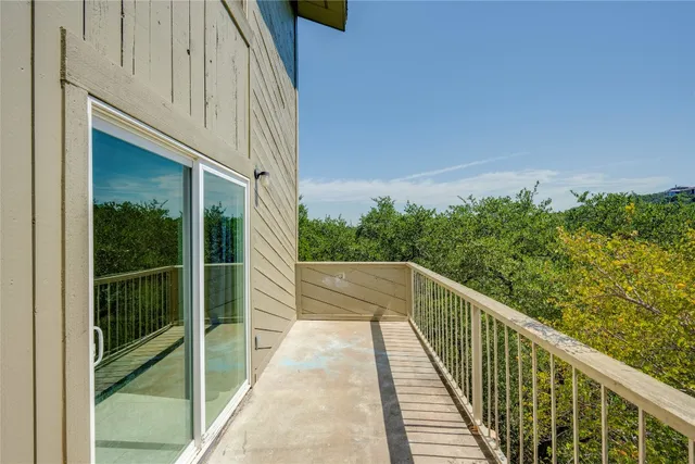 a view of balcony and yard