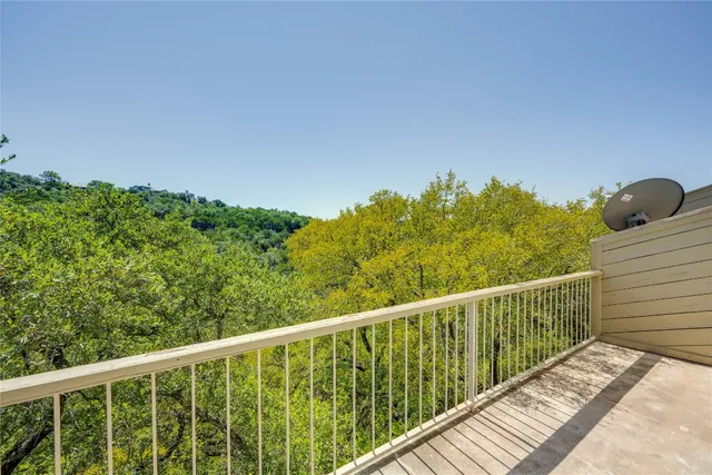 a balcony with an outdoor space