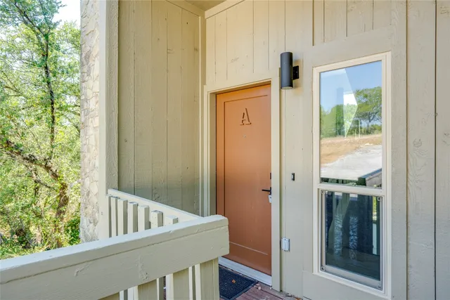 a view of balcony with small yard