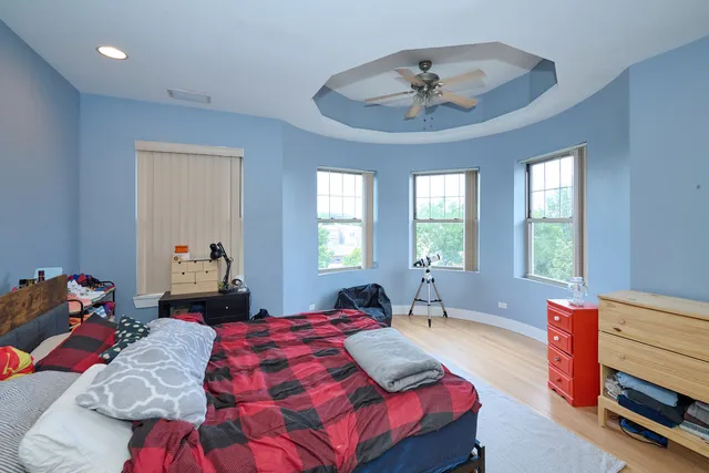 a bedroom with a bed and a dresser