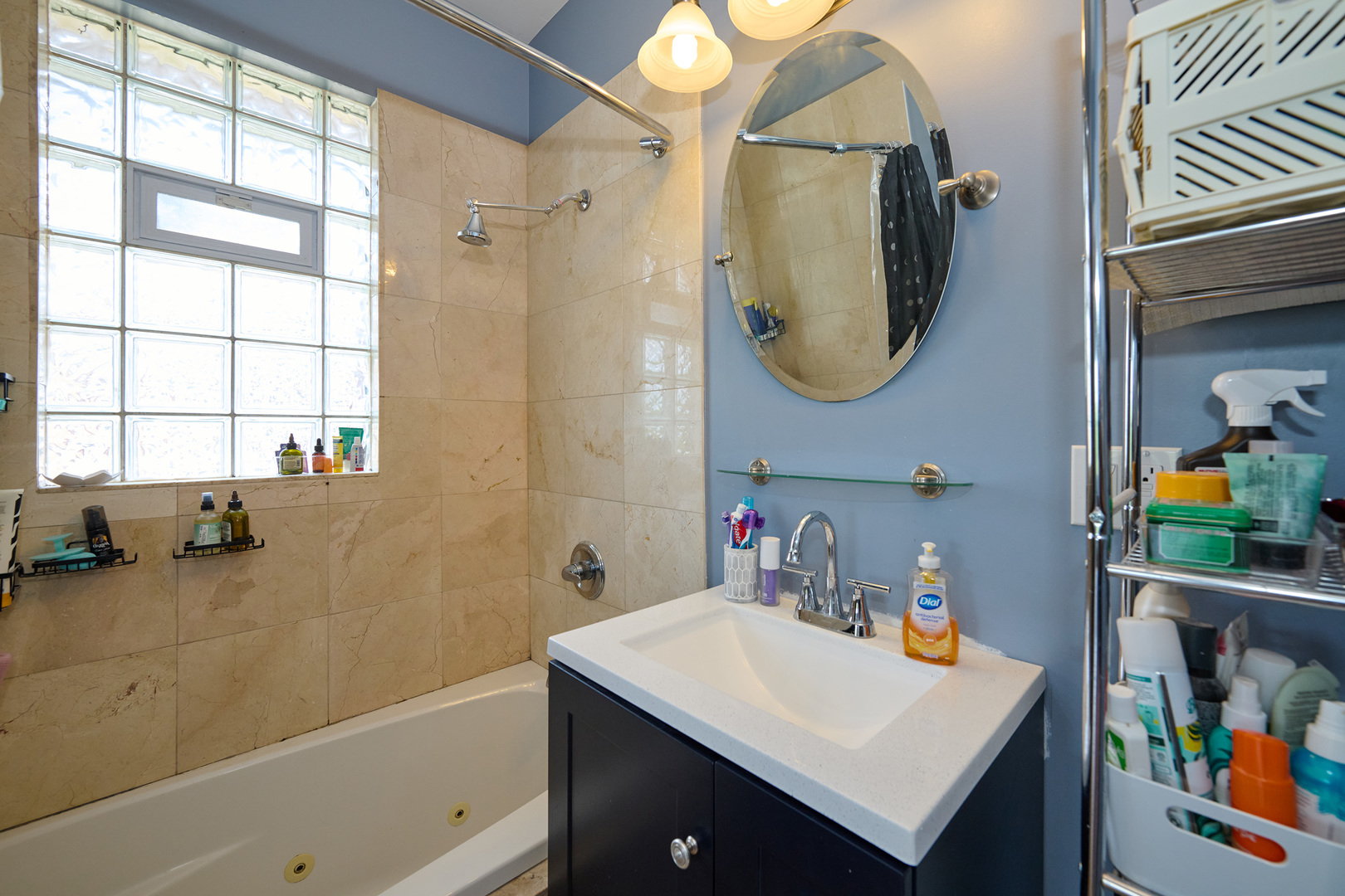 5711 North Kimball Avenue, Unit 3N Chicago, IL 60659 - Photo 17 of 24 a bathroom with a sink vanity and a mirror