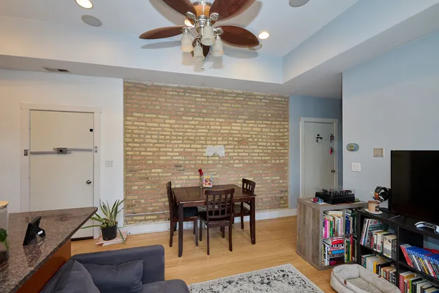 a view of a livingroom with furniture and a flat screen tv