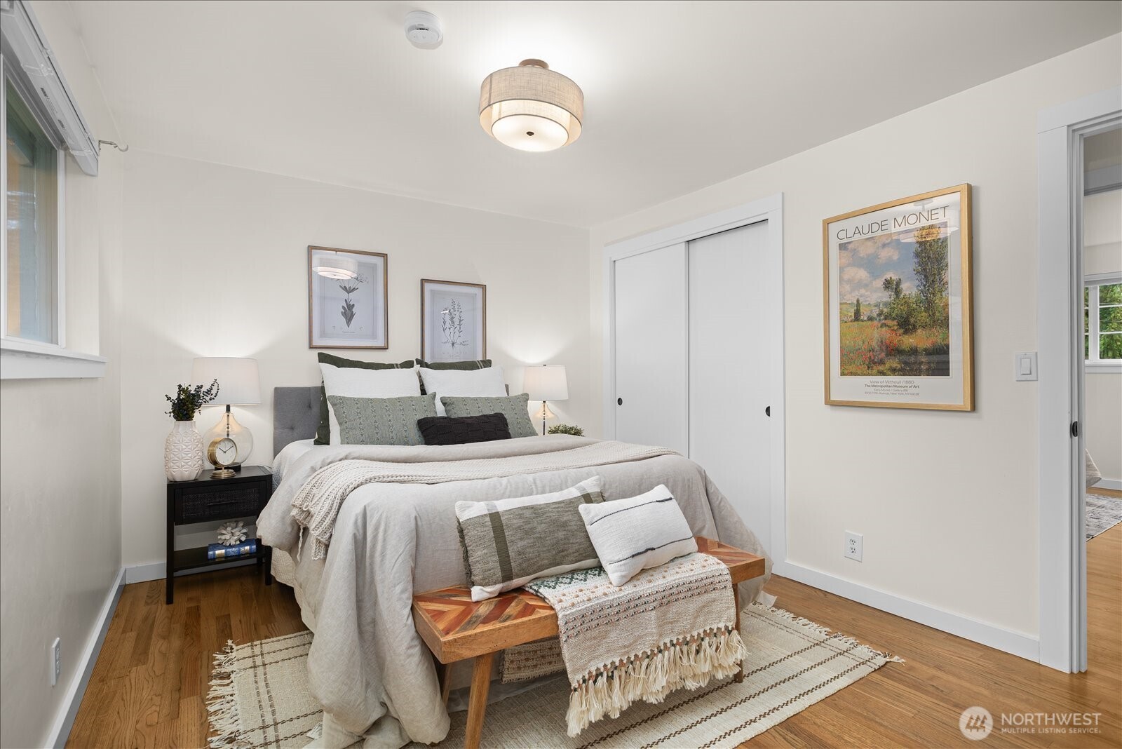 23409 94th Place West Edmonds, WA 98020 - Photo 15 of 39 a bed room with a bed and a painting on the wall