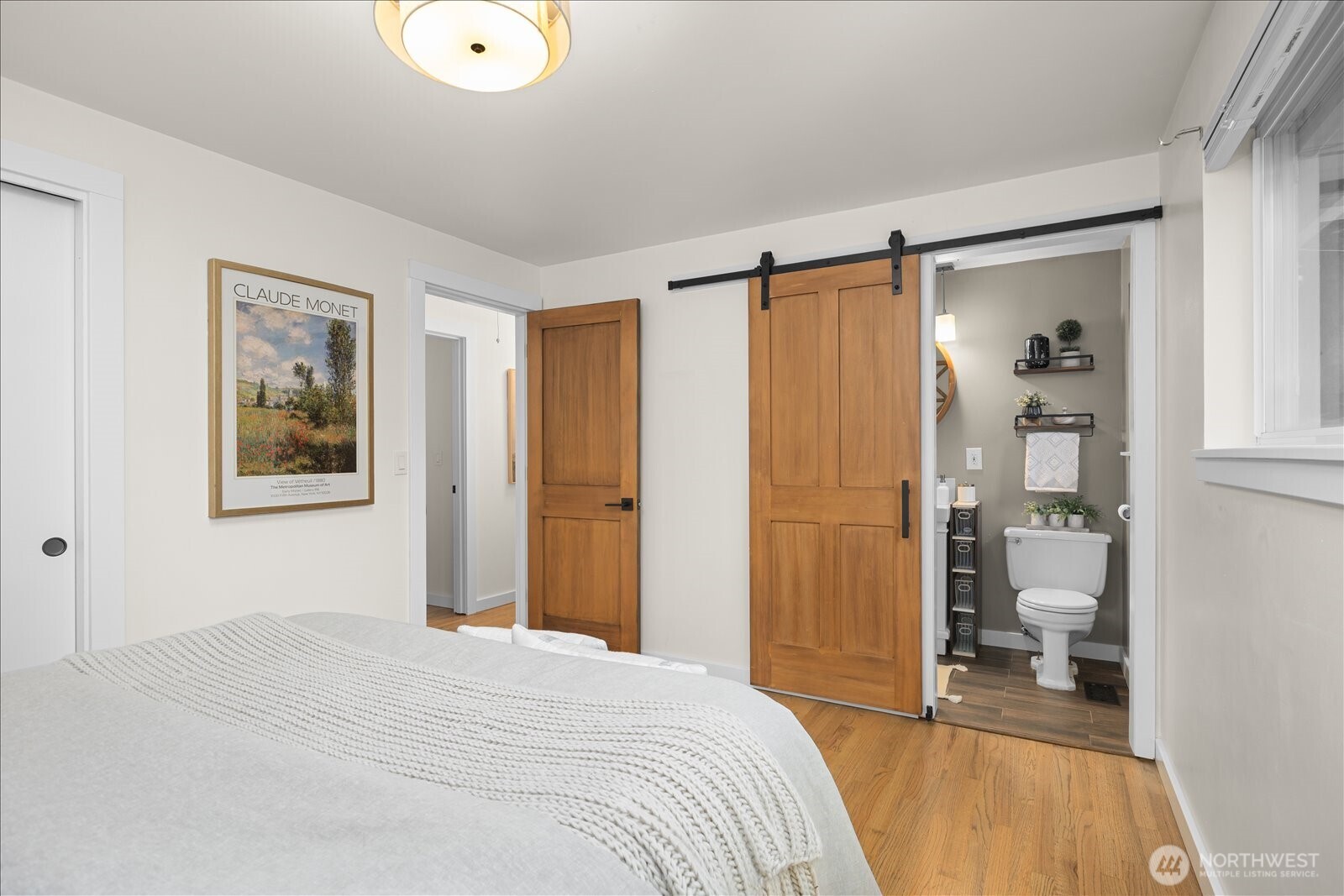 23409 94th Place West Edmonds, WA 98020 - Photo 16 of 39 a bedroom with a bed and a painting on the wall