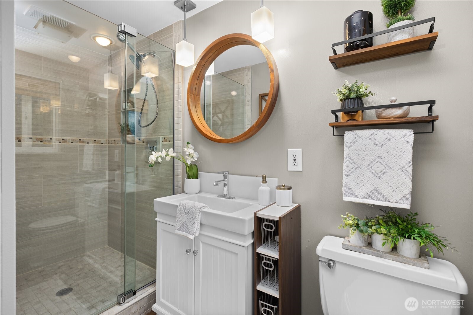 23409 94th Place West Edmonds, WA 98020 - Photo 17 of 39 a bathroom with a sink mirror toilet and shower