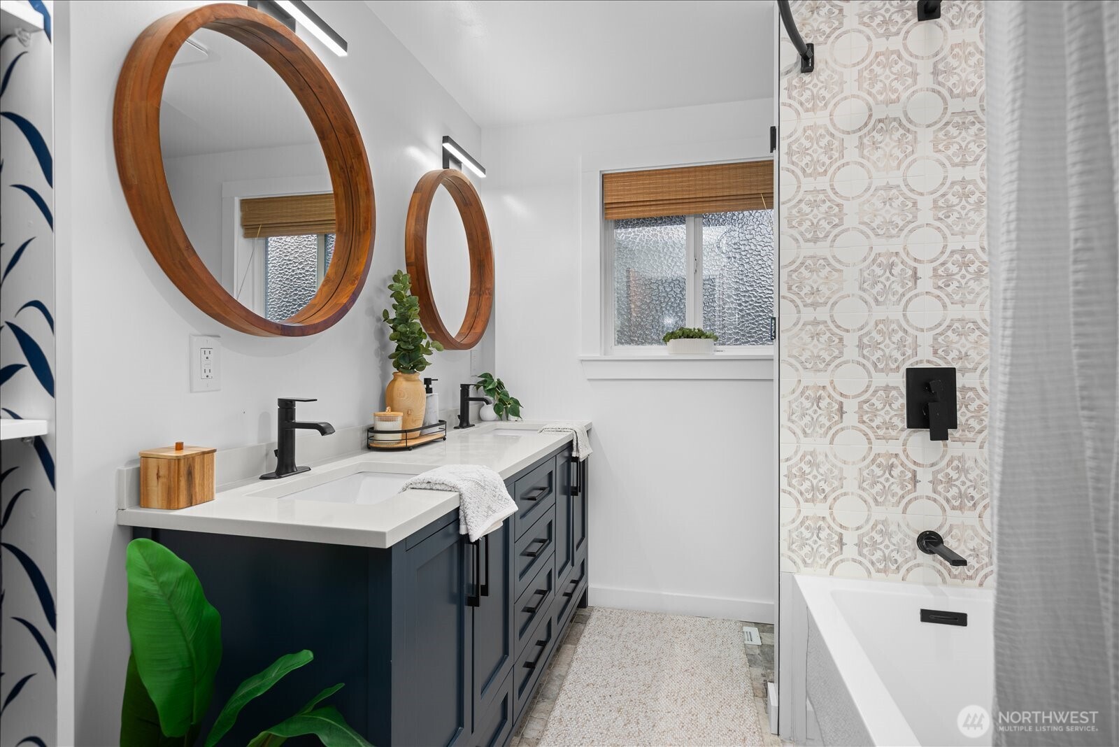 23409 94th Place West Edmonds, WA 98020 - Photo 20 of 39 a bathroom with a sink a mirror a vanity and a window