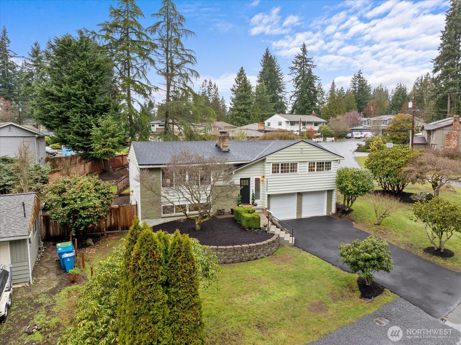 23409 94th Place West Edmonds, WA 98020 - Photo 2 of 39 a view of a white house with a chairs in a patio