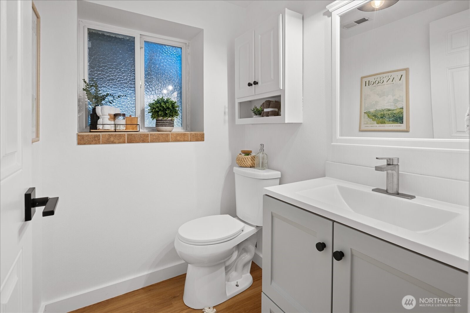23409 94th Place West Edmonds, WA 98020 - Photo 27 of 39 a bathroom with a sink a toilet and mirror