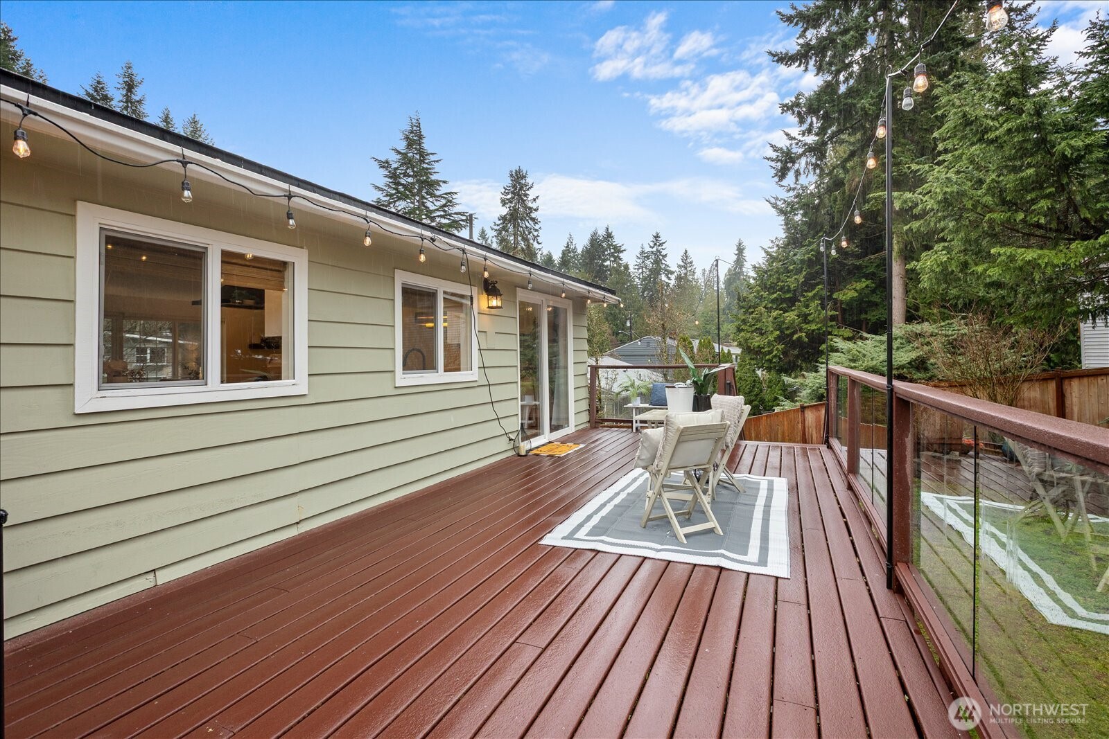 23409 94th Place West Edmonds, WA 98020 - Photo 30 of 39 a balcony with wooden floor and outdoor seating