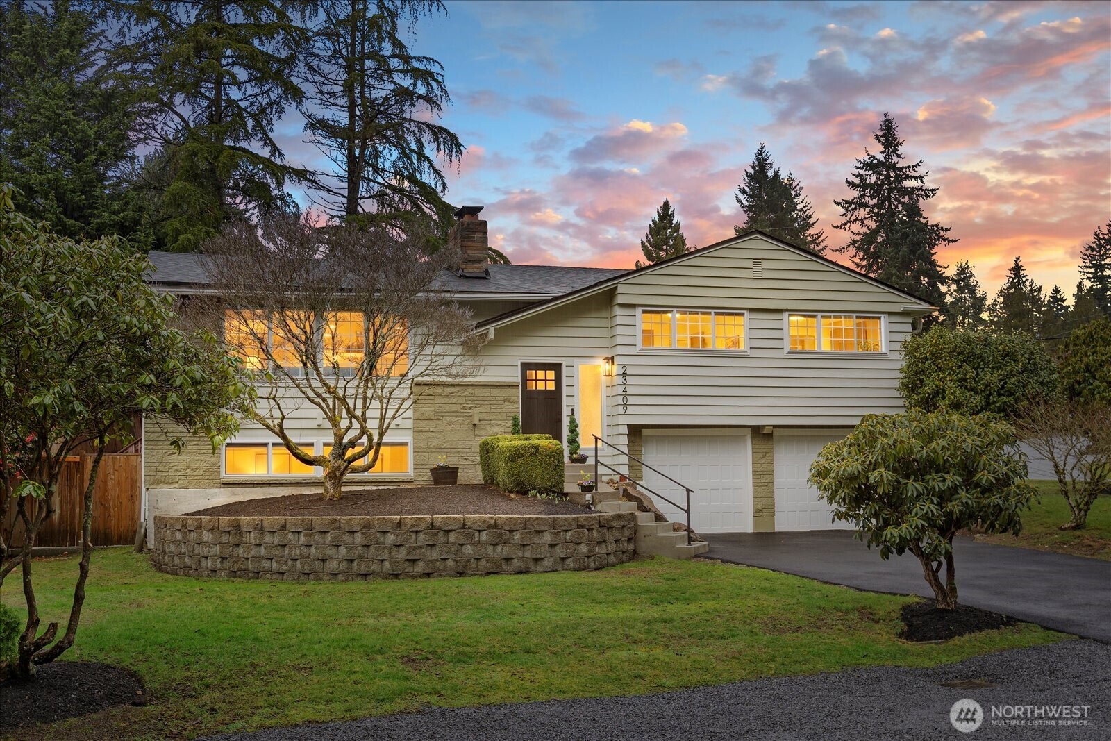 23409 94th Place West Edmonds, WA 98020 - Photo 3 of 39 a front view of a house with a garden