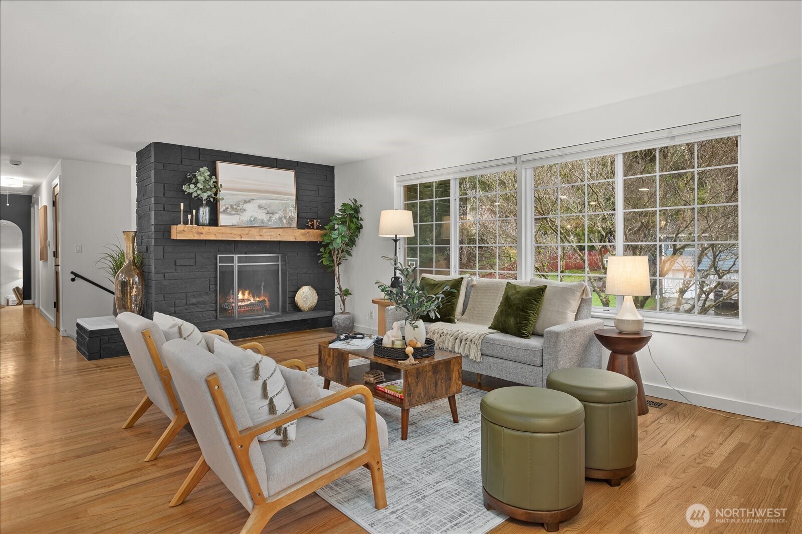 23409 94th Place West Edmonds, WA 98020 - Photo 5 of 39 a living room with furniture a fireplace and a large window