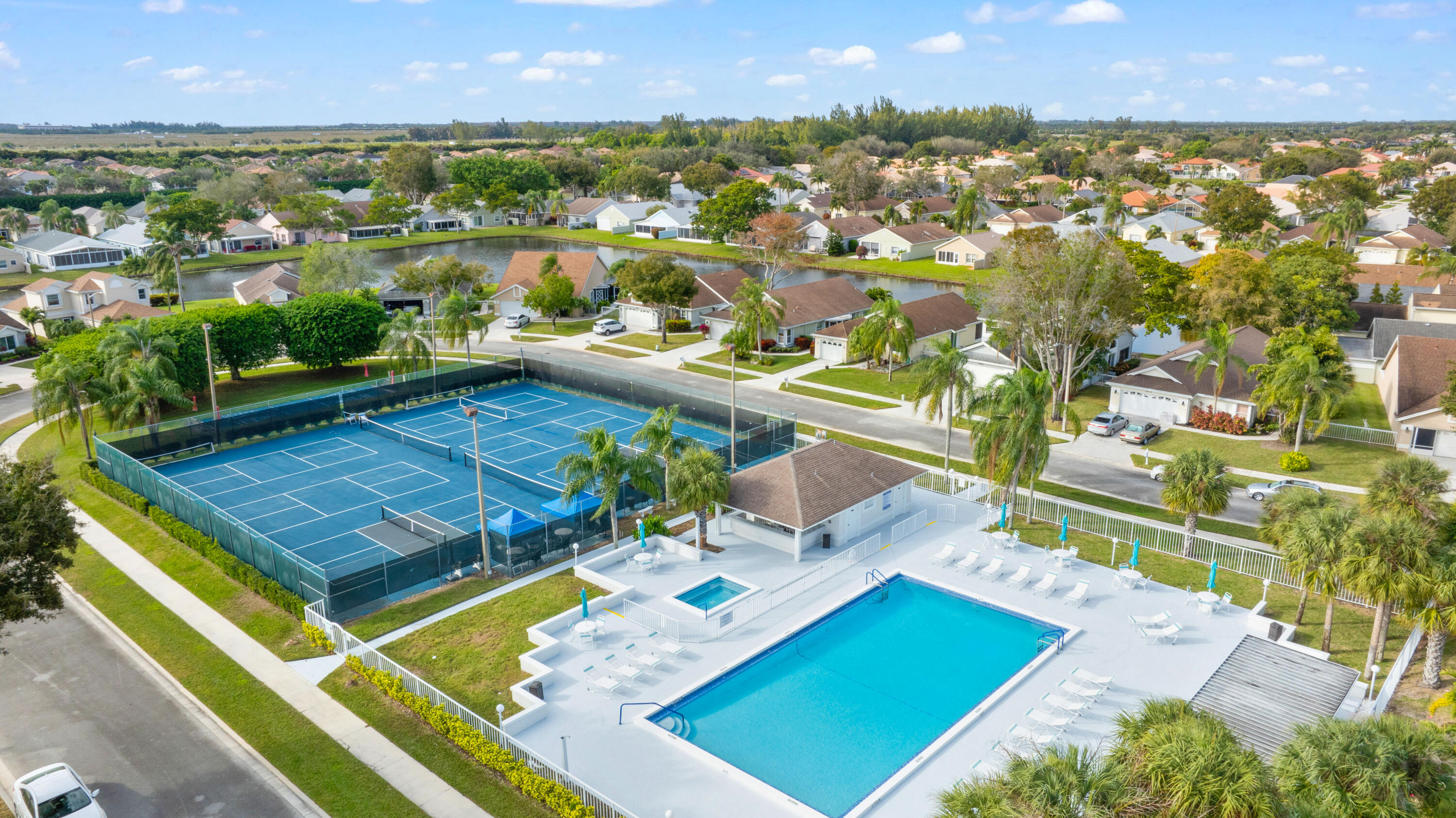 7961 Mansfield Hollow Road Delray Beach, FL 33446 - Photo 15 of 19 an aerial view of a pool