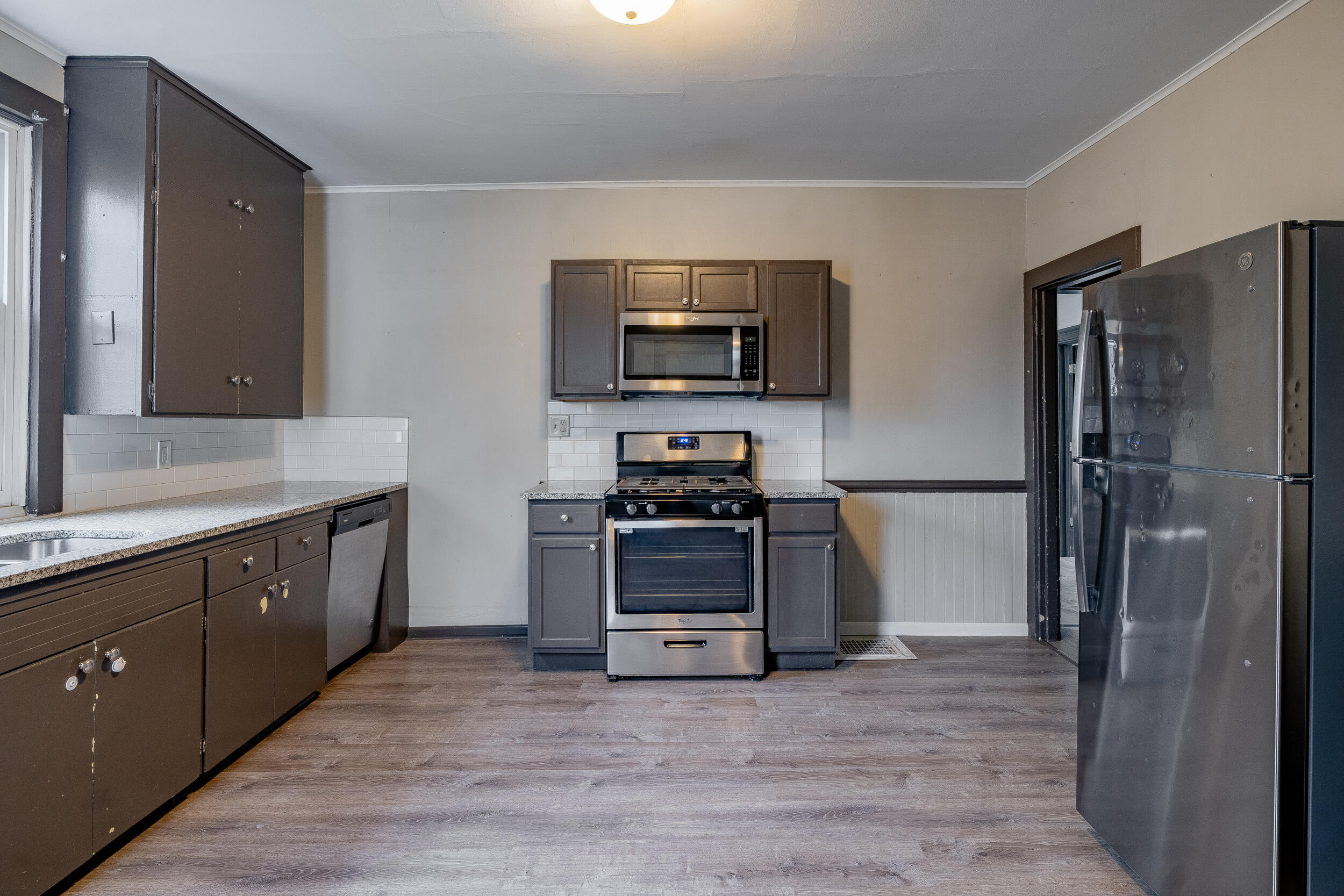 403 Rose Street La Porte, IN 46350 - Photo 13 of 28 a kitchen with a refrigerator and a sink