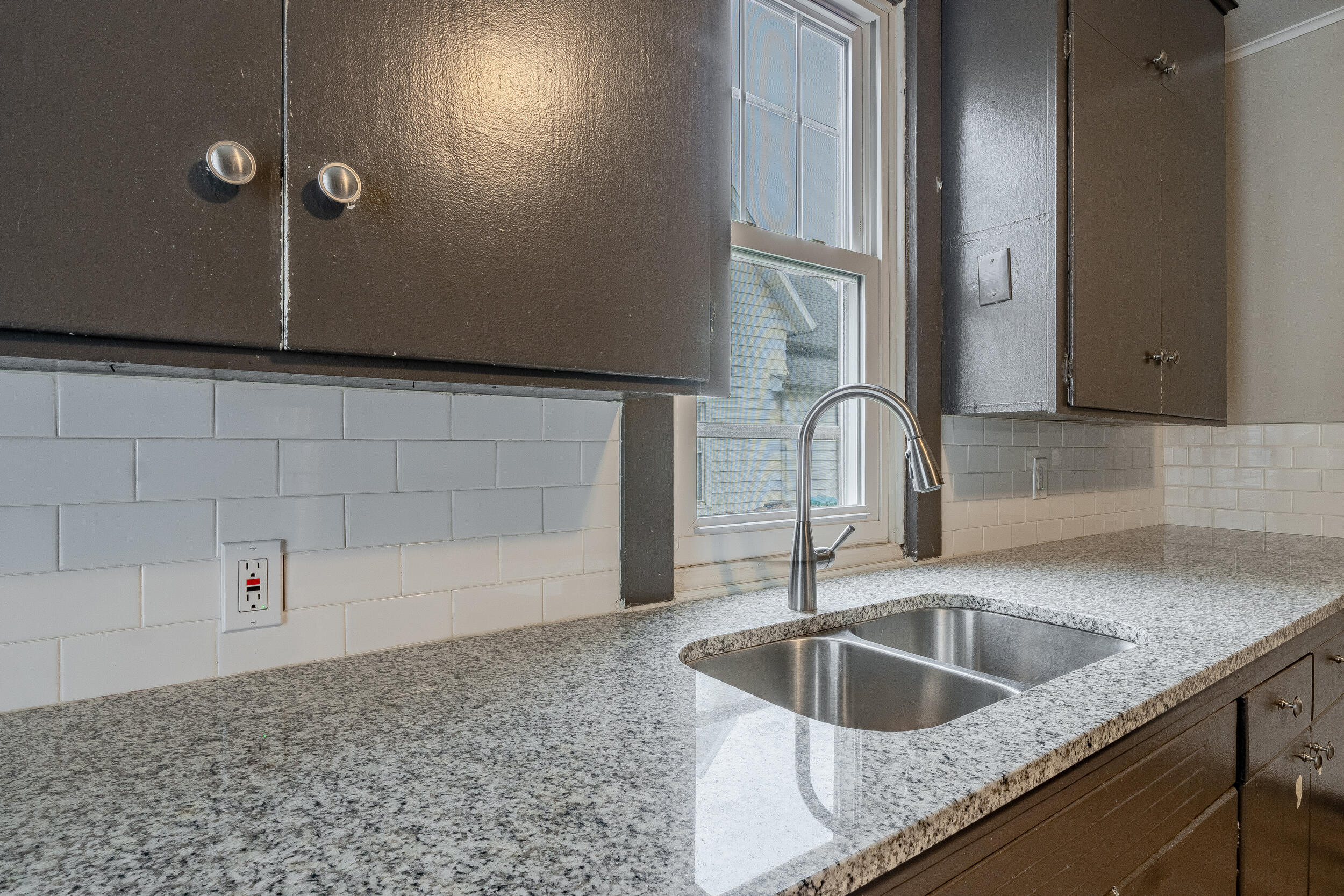 403 Rose Street La Porte, IN 46350 - Photo 14 of 28 a kitchen with a sink and granite